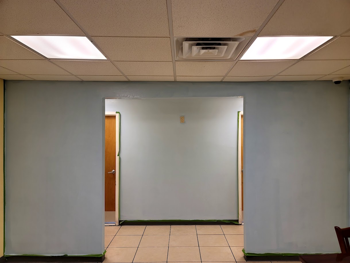 Borinquen Bakery dining area before the mural was painted