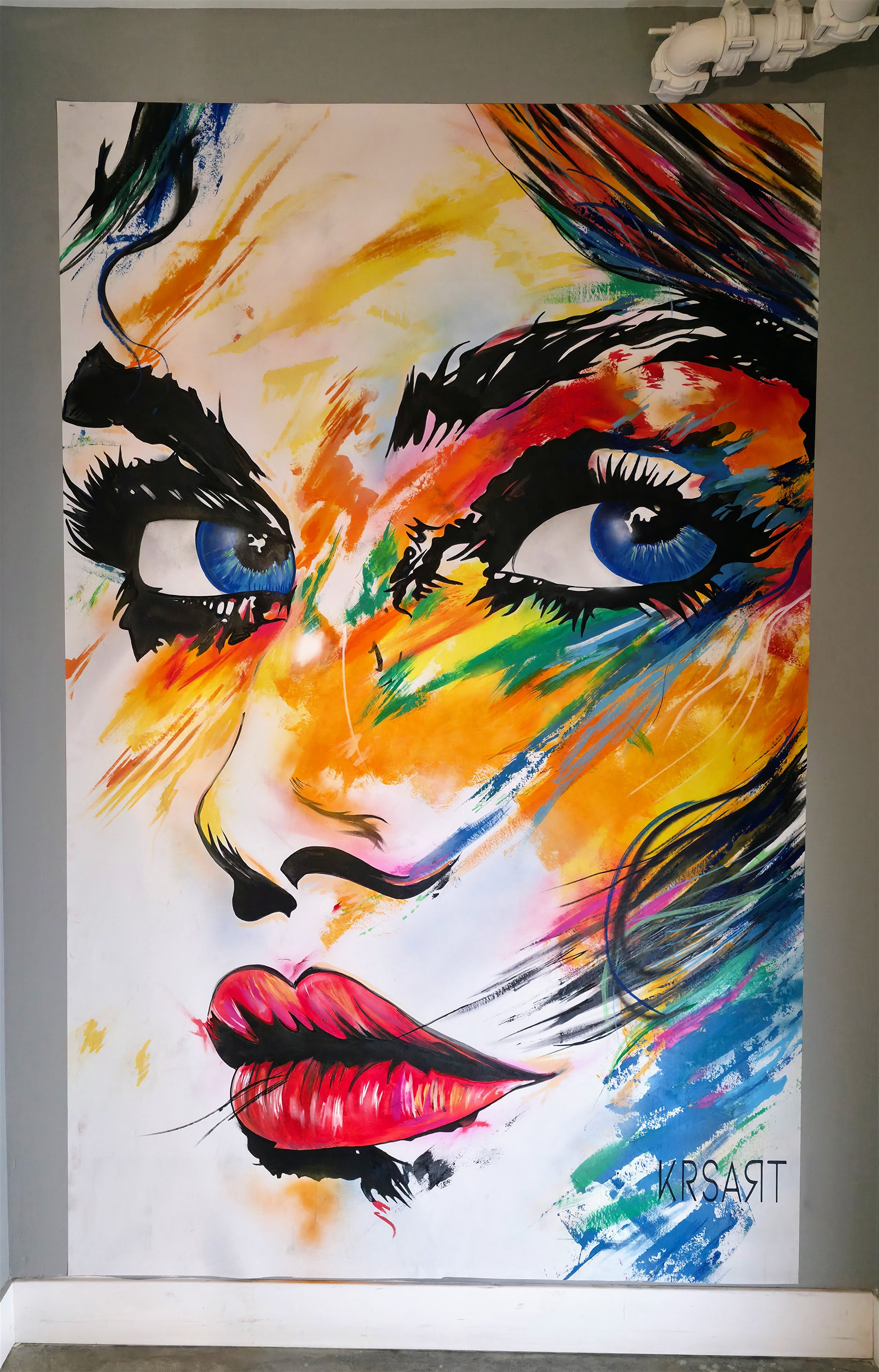 Color-rich portrait canvas from The Brit mural series