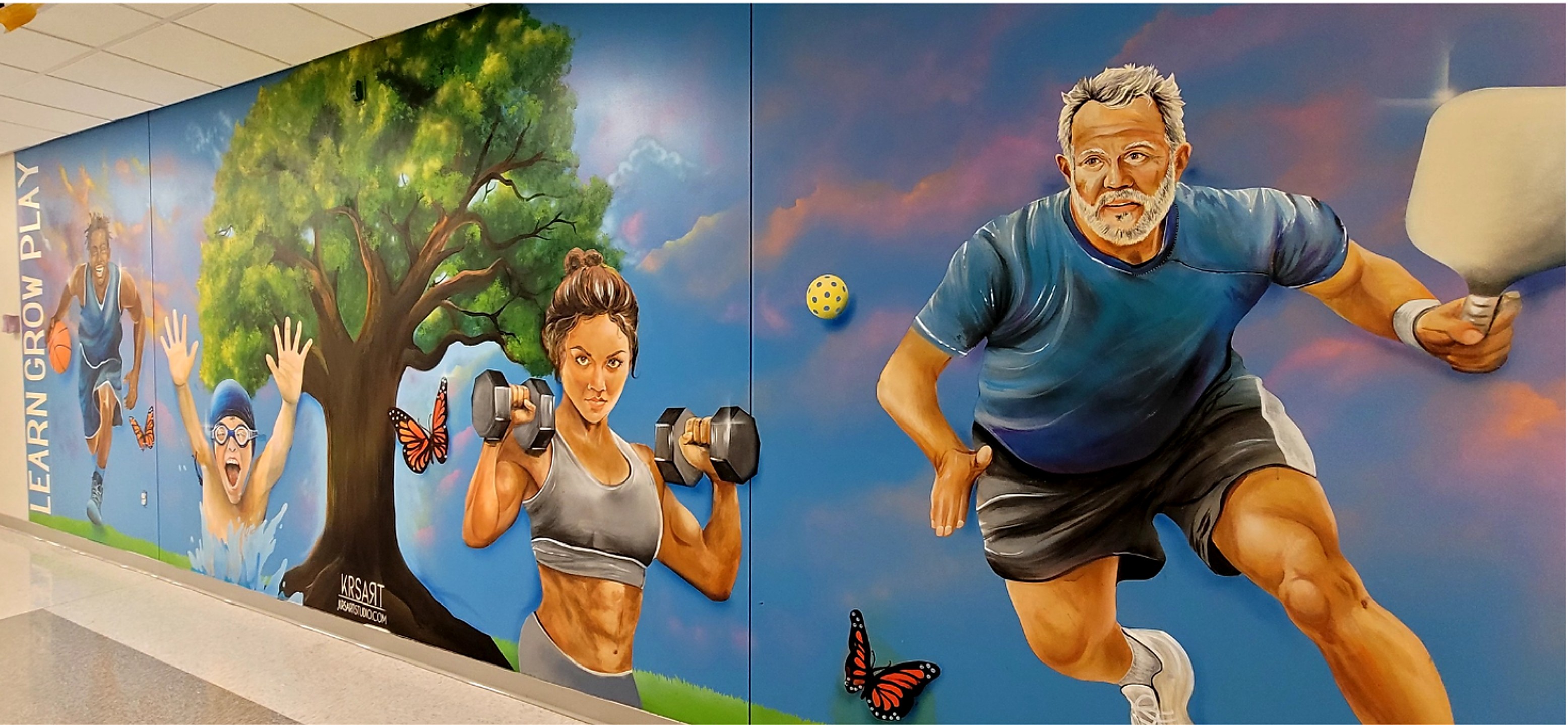Parks and recreation mural with athletes and fitness imagery